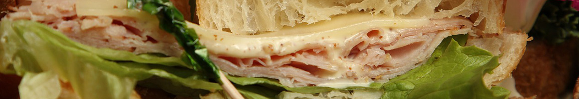 Eating Sandwich at Booeymonger restaurant in Arlington, VA.